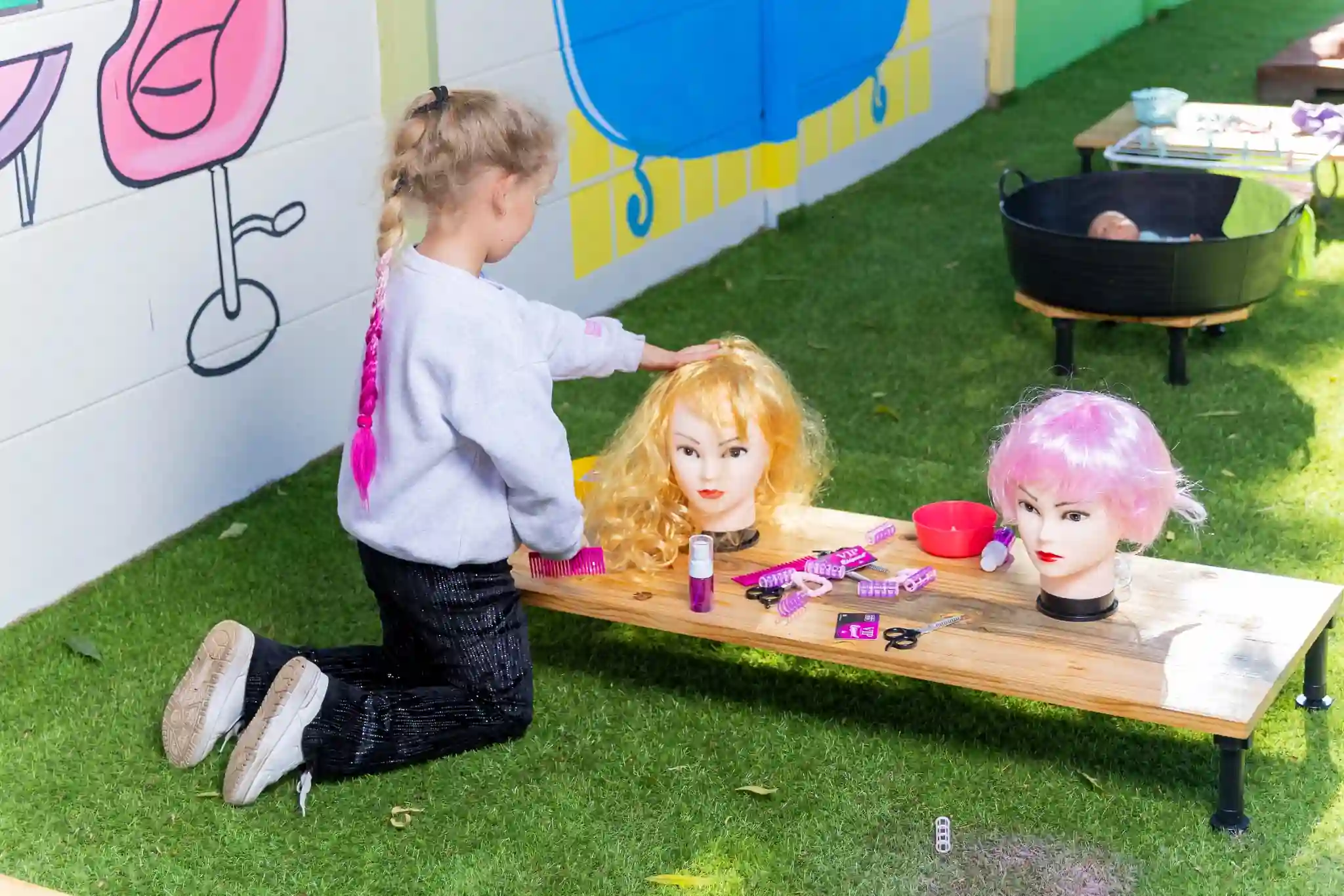 Children enjoying a vibrant and joyful play moment at Elohim Tiny Treasures